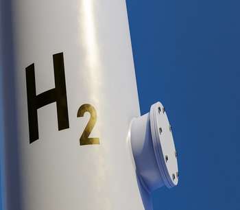 An industrial pipe with the scientific name for hydrogen (H2) emblazoned on the front