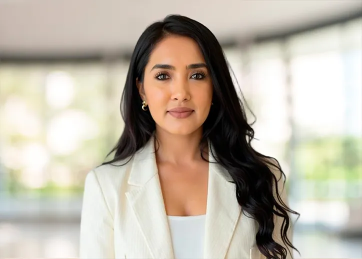 Reshmi Singh Maharaj smiles at the camera.