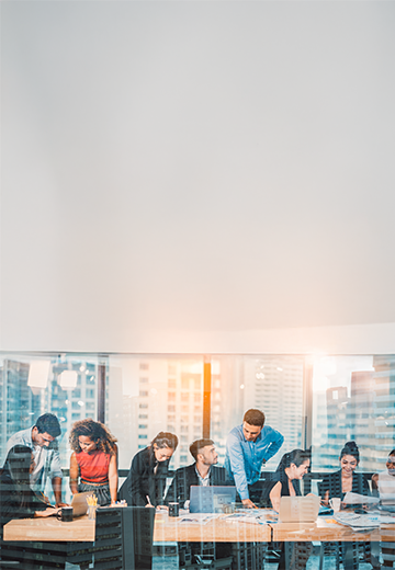 A group of professionals around a boardroom table