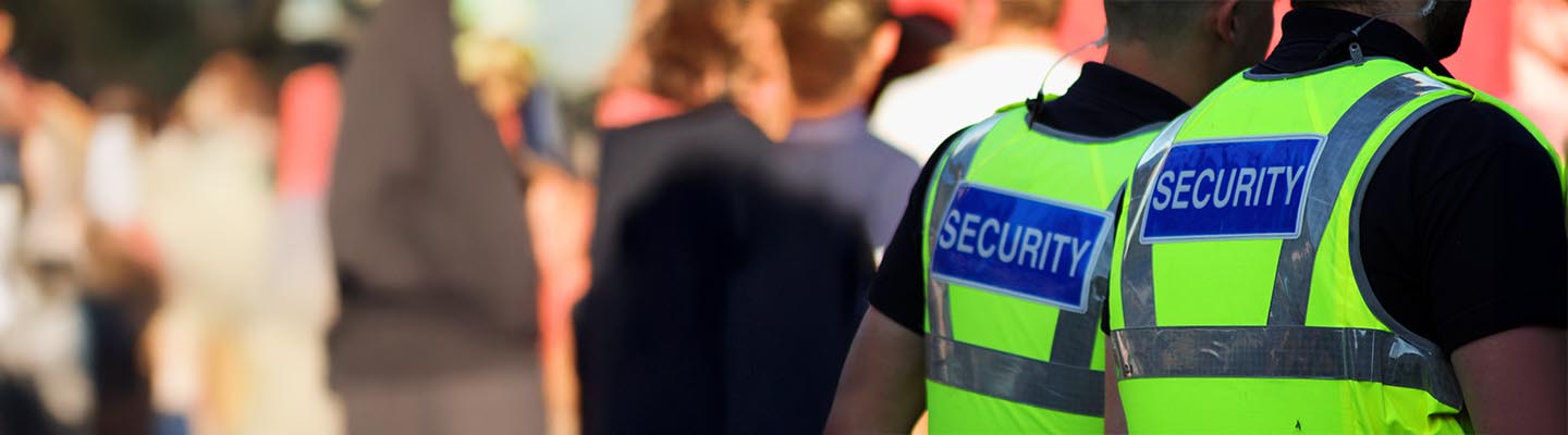Security guards overlooking an event.