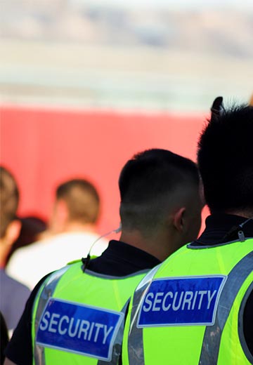 Security guards overlooking an event.