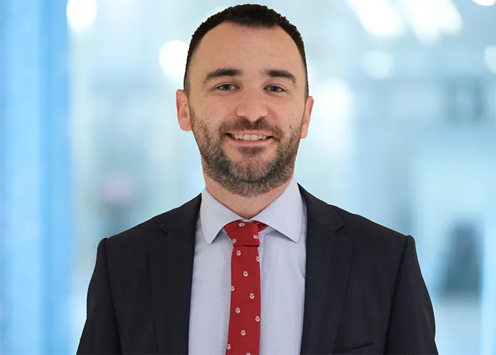 Joseph Green, risk advisory services, smiling at the camera. 