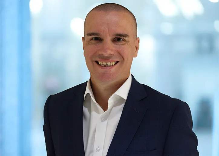 Fridrich Housa, Director, IFRS & Corporate Reporting Assurance smiling at the camera. 