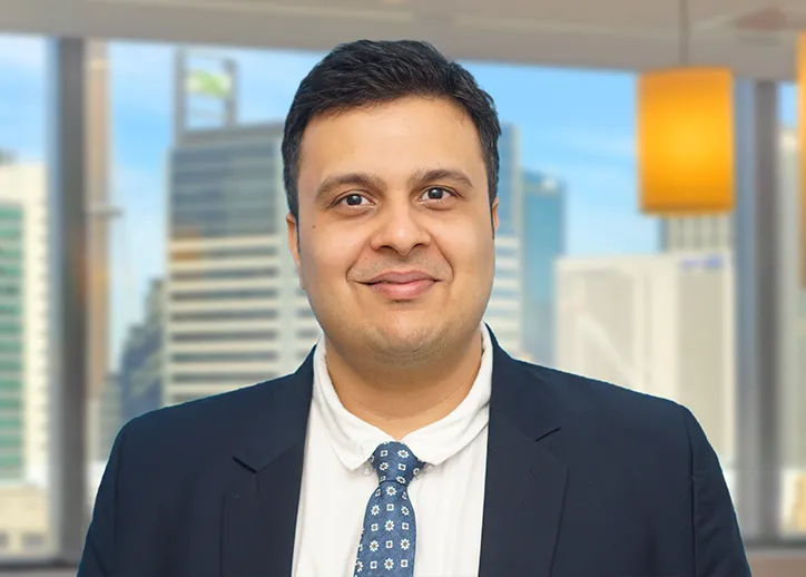 Riddhit Desai smiling at the camera.