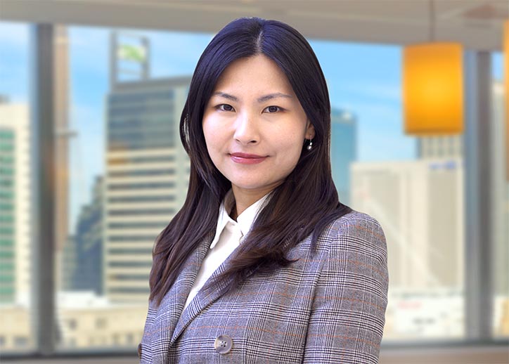 Monica Lei, Business Services, smiling at the camera.