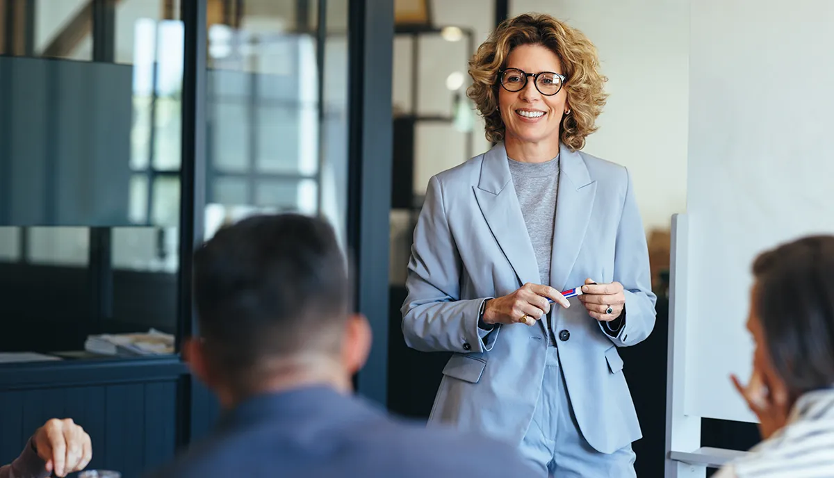 Business leader talking to employees.