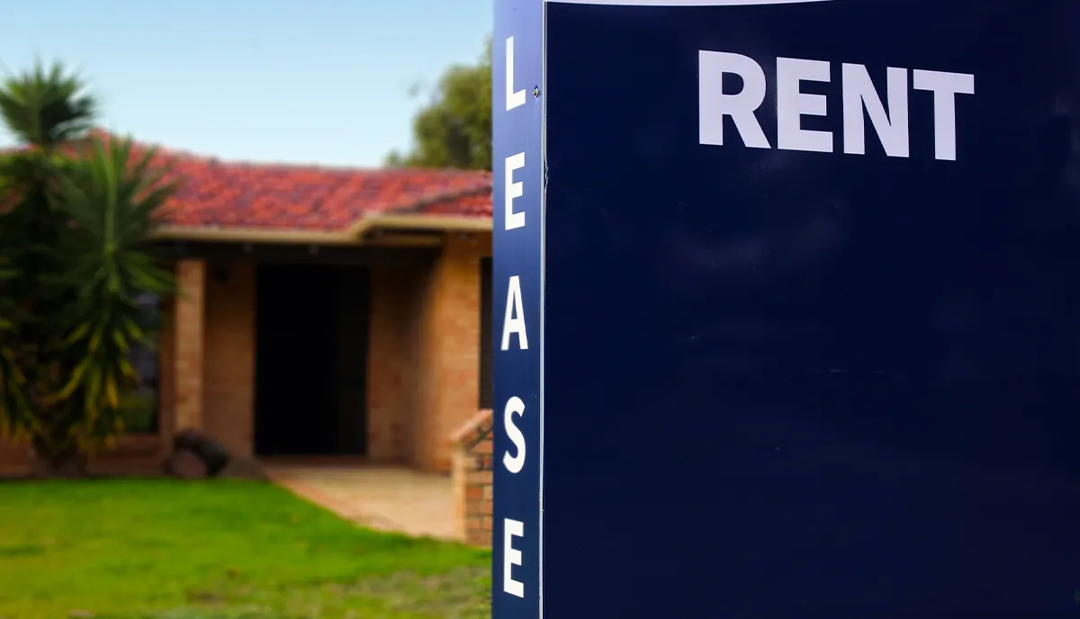 For rent sign in front of a rental property. Real estate and housing market.