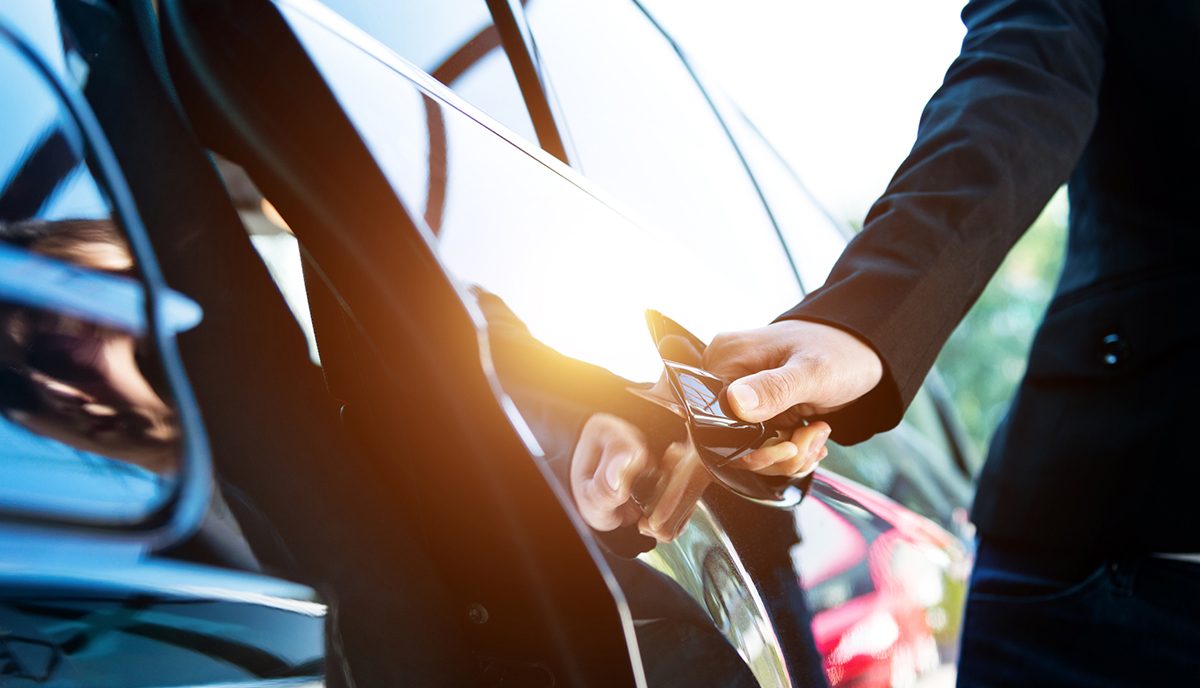 A man opening a car door