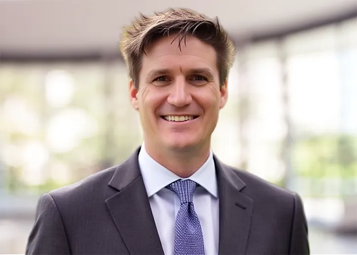 Craig Mitchell smiles at the camera