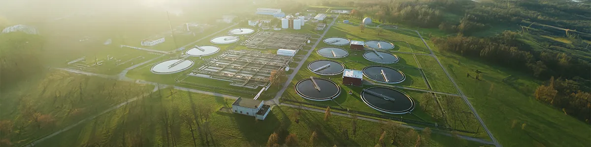 Circular wastewater tanks at industrial facility.