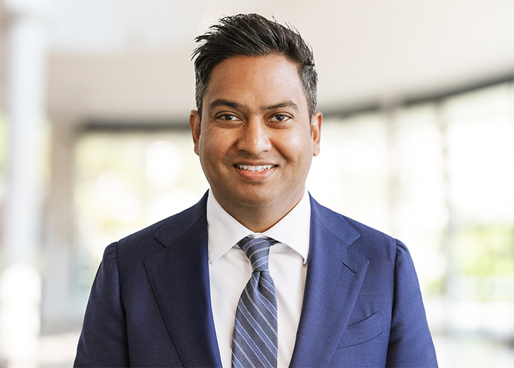 Nabil Hossain smiling at the camera. 