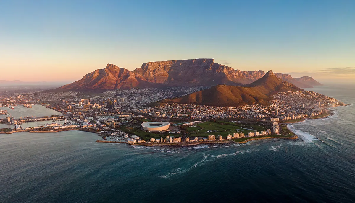 Aerial panoramic view of Cape Town cityscape at sunset, Western Cape Province, South Africa.