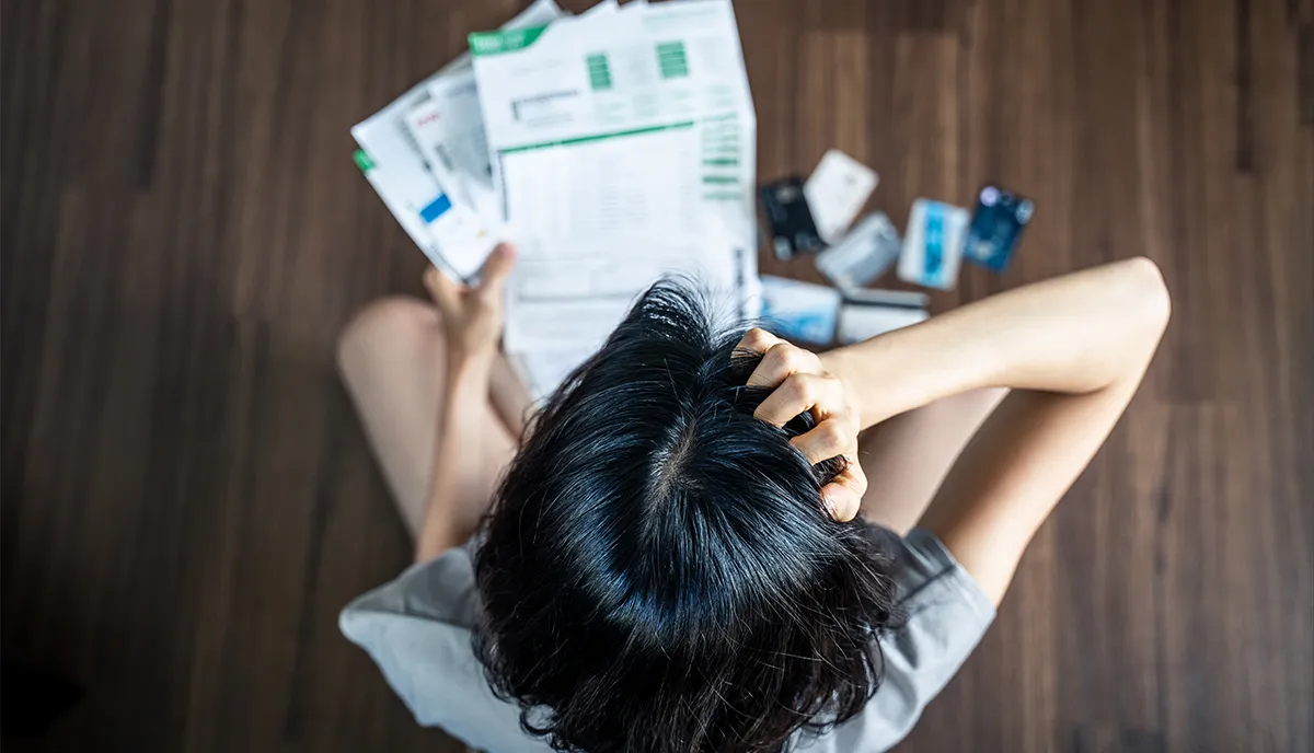 Stressed person looking for rental properties, looking at increased rental prices and house affordability.