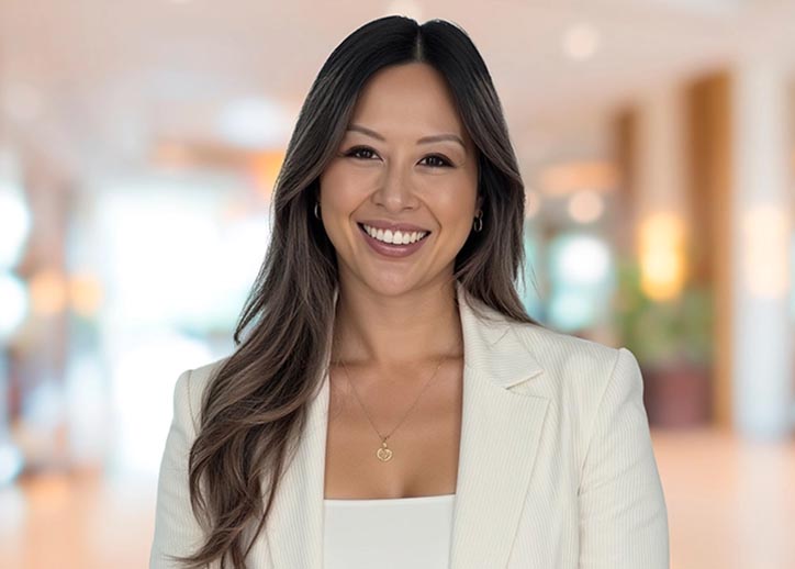 Lilian Te, corporate & international tax, smiling at the camera.