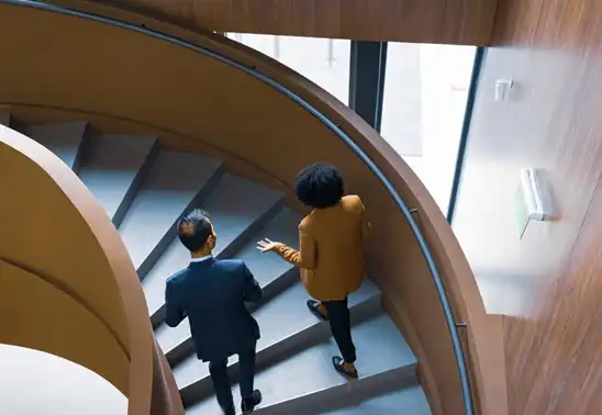 Decorative image of people walking up stairs.