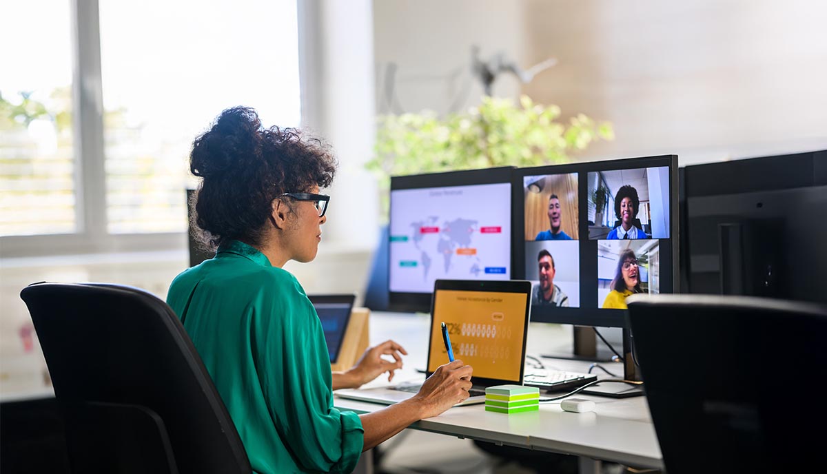 Professional presenting to her team via a virtual team call.