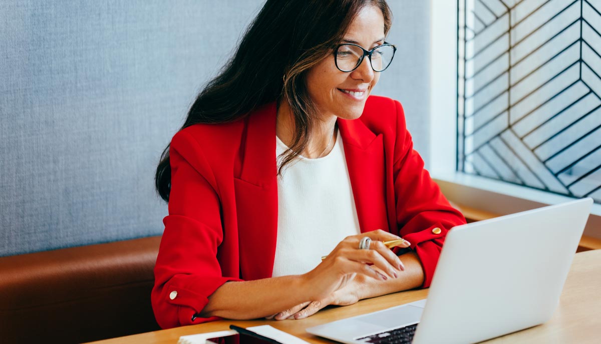 Decorative image of individual looking at laptop.