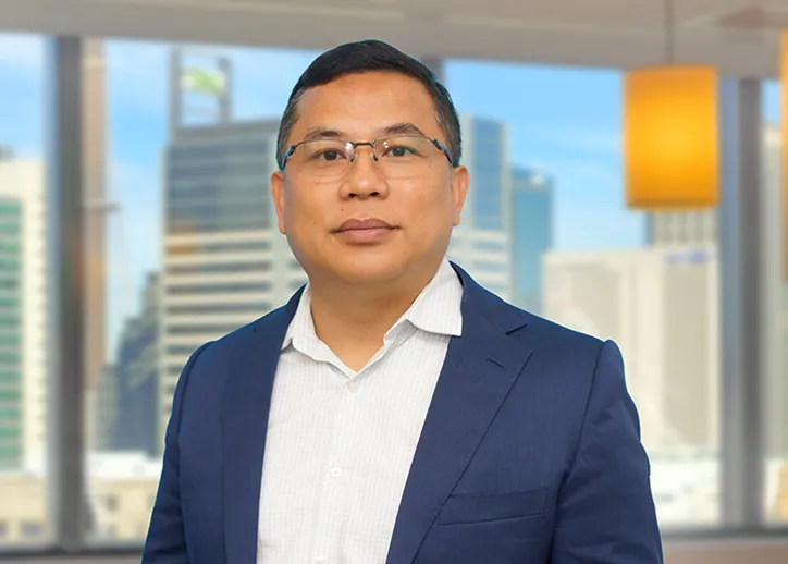 Jude Doliente, Director, IFRS and Corporate Reporting smiling at the camera.