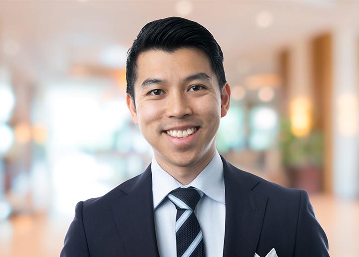 Aaron Seeto, business services, smiling at the camera.