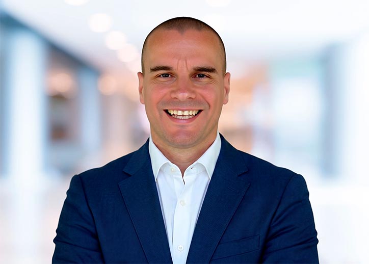 Fridrich Housa, Director, IFRS & Corporate Reporting Assurance smiling at the camera. 
